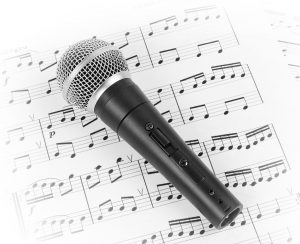 fontgraf141100108.jpg - dynamic microphone on music sheet