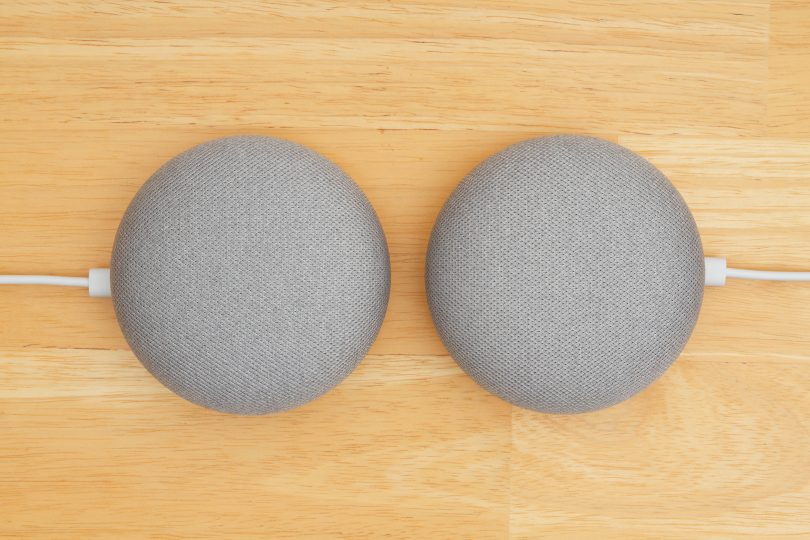 South Carolina, USA Oct 2018. Illustrative editorial image of two Google home devices on a wood desk