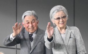 Japan's former emperor Akihito (2L) and empress Michiko (C) wave during the Japan 2019 Rugby World Cup bronze final match between New Zealand and Wales at the Tokyo Stadium in Tokyo on November 1, 2019. (Photo by Kazuhiro NOGI / AFP)