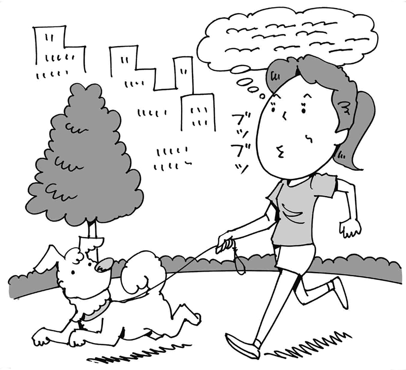犬の散歩をしている女性
