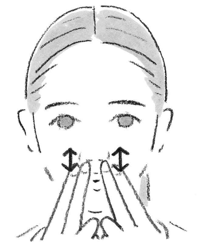 鼻の穴の真下に人差し指と中指の第1関節をつけ、筋肉をほぐしている