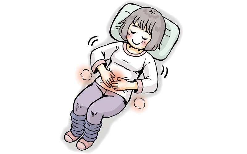 仰向け状態でお腹をマッサージする女性のイラスト