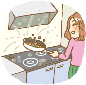 キッチンで料理している女性