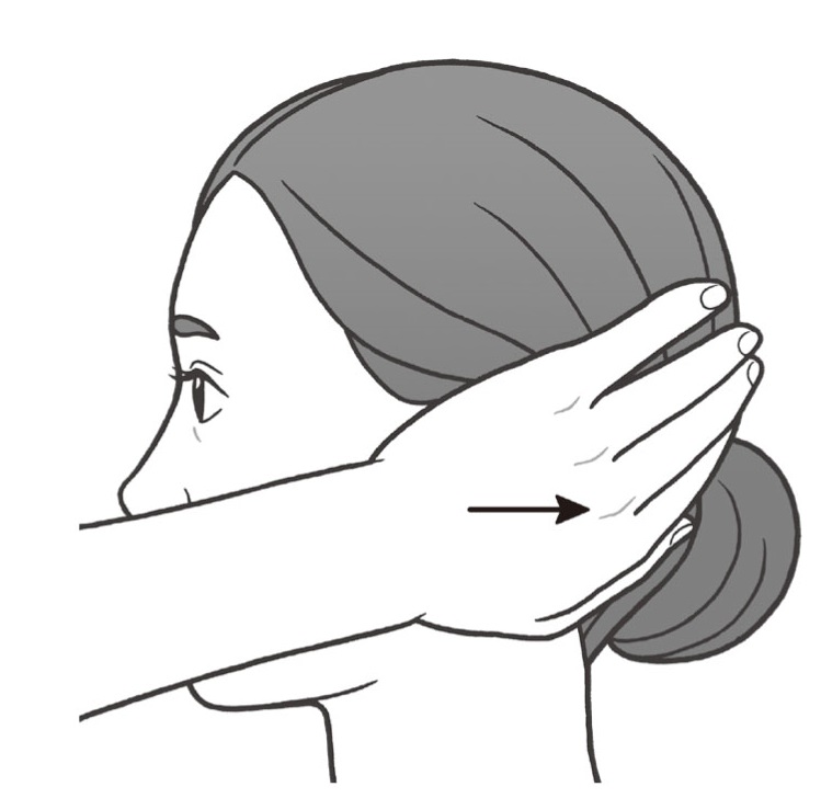 手のひらで耳を多い後頭部へ手を移動させる