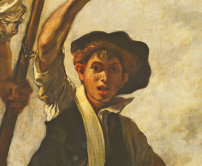 「抵抗」の象徴である黒い帽子を被った少年