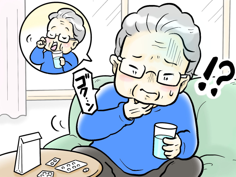 薬を飲むシニア